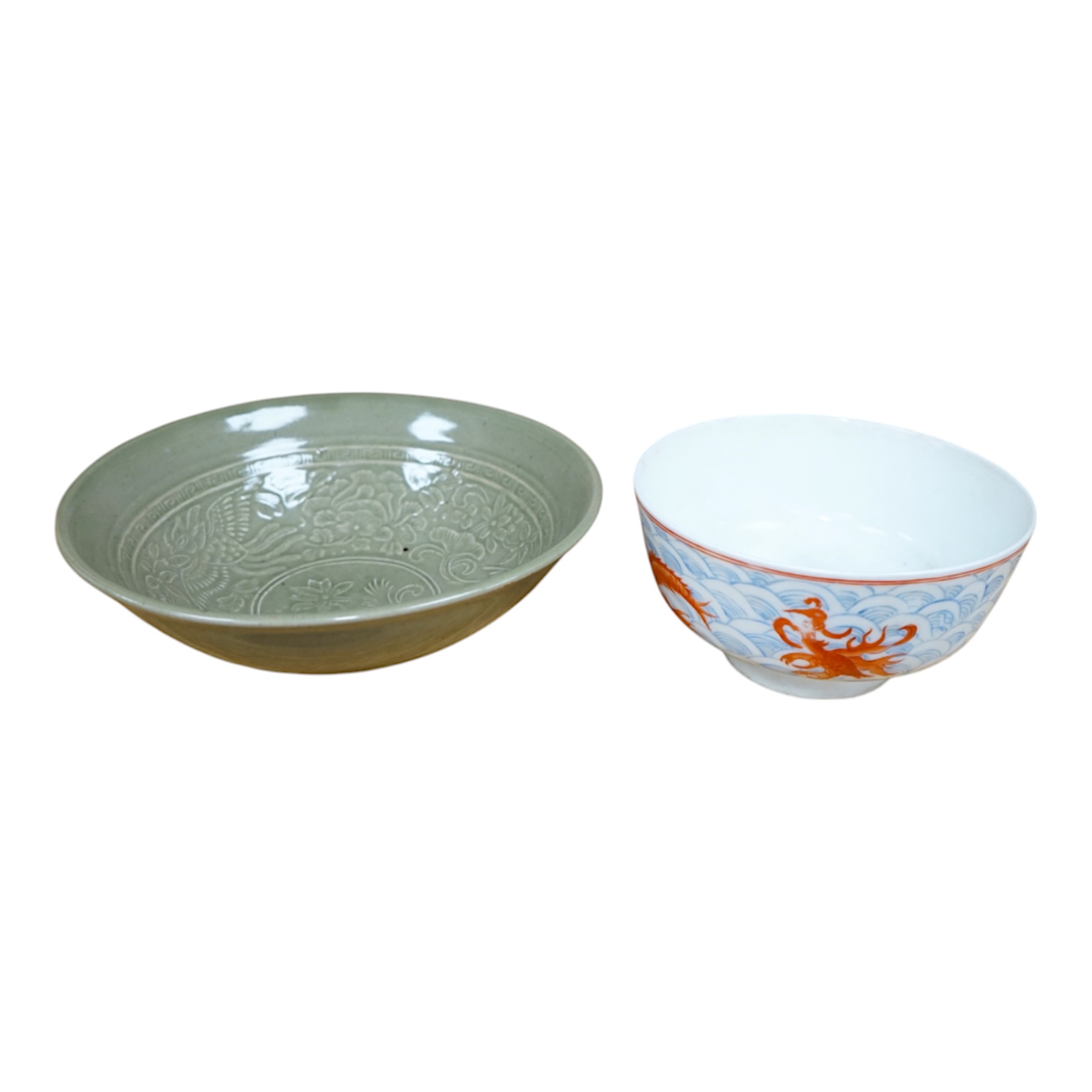 A Chinese Celadon glazed bowl and another, largest 19.5cm diameter. Condition - some wear